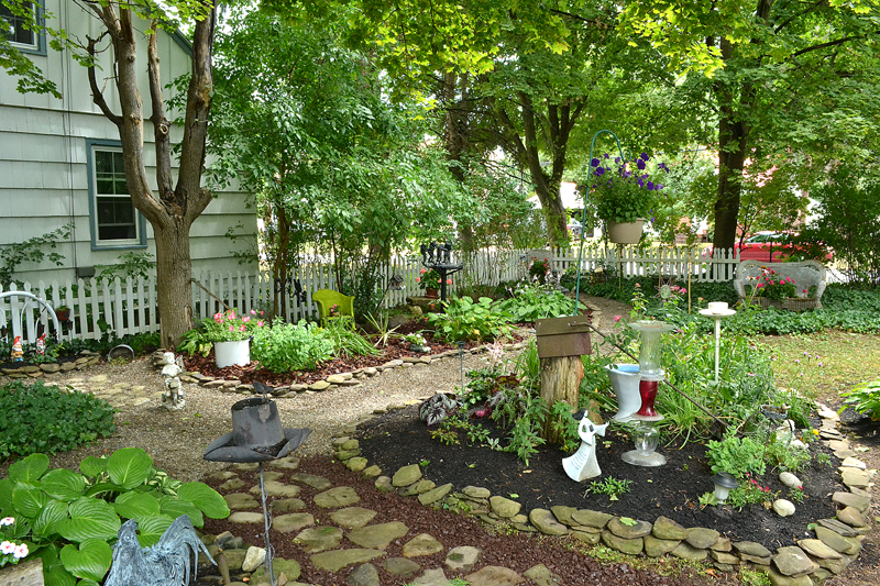 Too shady for grass, Hamburg yard is filled with gardens, paths